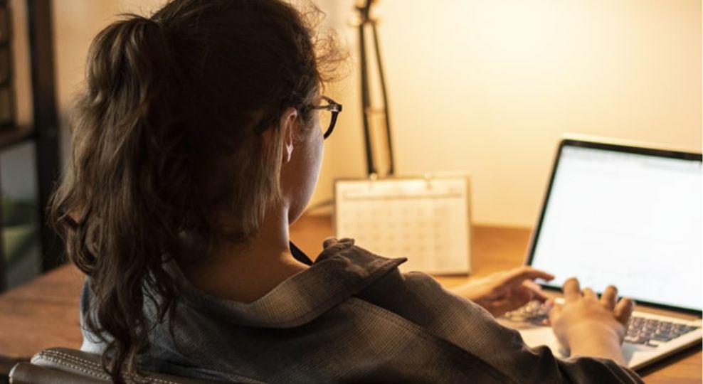 An image of a young person on their laptop looking up resources to cope with upsetting news