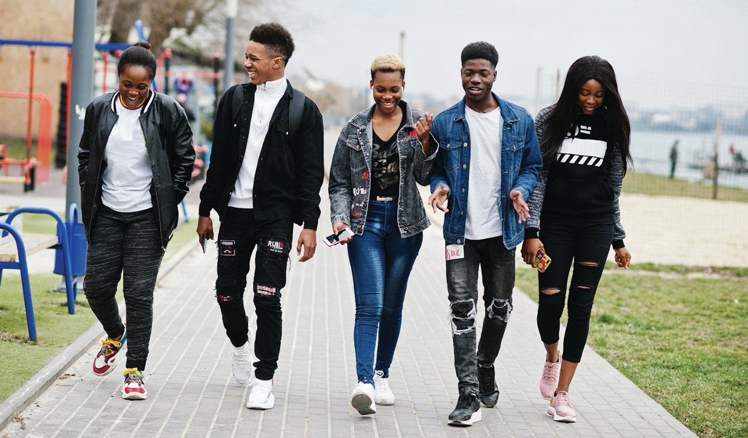 An image of a group of Black youth walking together outdoors on a Kids Help Phone webpage